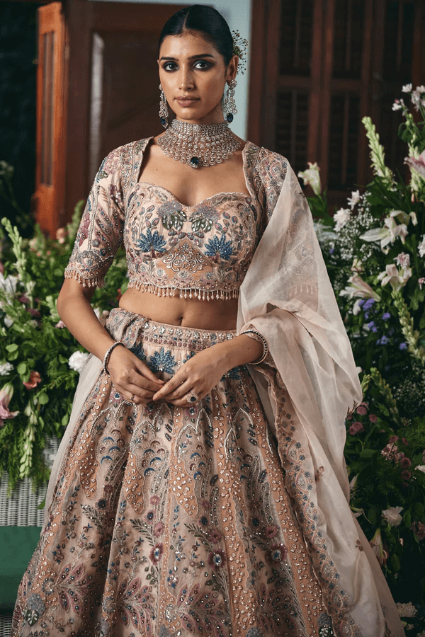 Pale pink organza flared lehenga with Zardosi Resham and sequins embroidery and a readymade designer blouse.