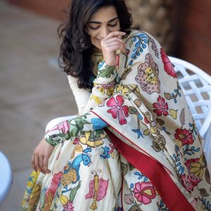 Handcrafted white oversize kurta set featuring vibrant hand-painted floral and bird motifs with a red border