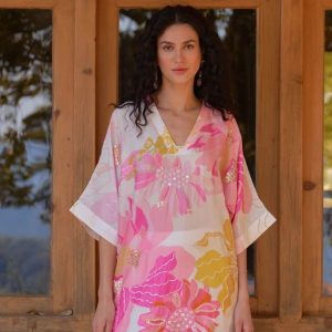 White and pink silk tunic with hand sequin embroidery wild rose floral print and color blocked pants.